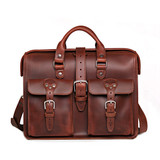 Red brown leather flight bag briefcase with two front pockets and handles for easy carry. Made by Saddleback