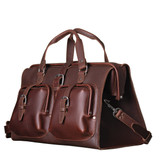 Angled view of Saddleback Leather's Deep Pocket Leather Duffle Bag in Red Brown / Chestnut