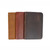 3 of the pocket notebooks stacked over each other in the colors tobacco, chestnut,  and dcb.