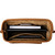Top down view of leather purse with items in it.