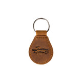 Leather membership keychain in tobacco with the Saddleback logo