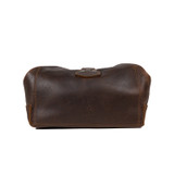 Back of the dark coffee brown toiletry dry bag that is buckled shut. Made by Saddleback