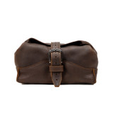 Dark coffee brown toiletry dry bag buckled shut. Made by Saddleback