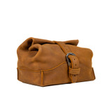 Angled view of the tobacco colored toiletry dry bag. Made by Saddleback