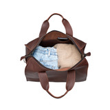This is the inside of the simple overnight leather duffle bag in chestnut filled