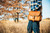 Here is a model with a rounded satchel on in front of a fall tree. Made by  Saddleback