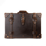 Dark brown leather luggage front view.