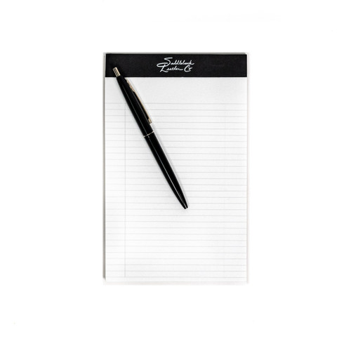 Medium notepad with pen to show relative size.