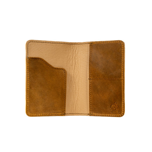This is the inside of the slim leather passport wallet in tobacco. Made by Saddleback