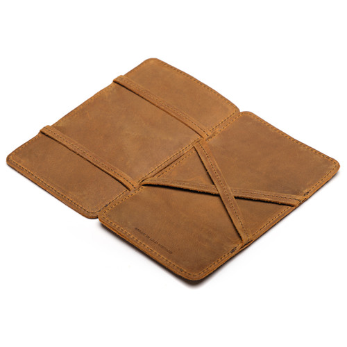 Tobacco leather large magic wallet from the inside. The money moves when you flip around the wallet flap. Made by Saddleback