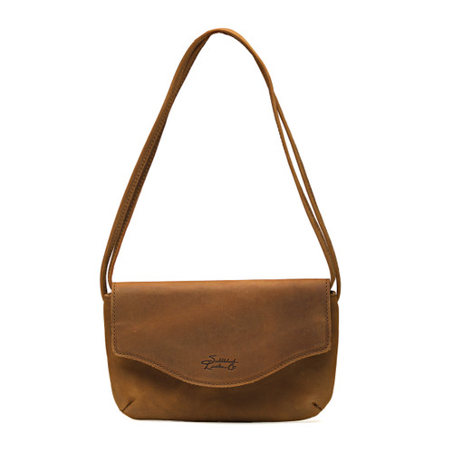 Front of the tobacco colored leather womens clutch with a flap closure. Additionally, the strap is adjustable for whatever length you prefer. Made by Saddleback