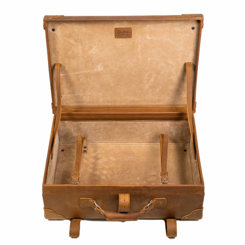 Inside of the tobacco colored medium suitcase. Includes straps inside to securely hold anything in place. Made by Saddleback